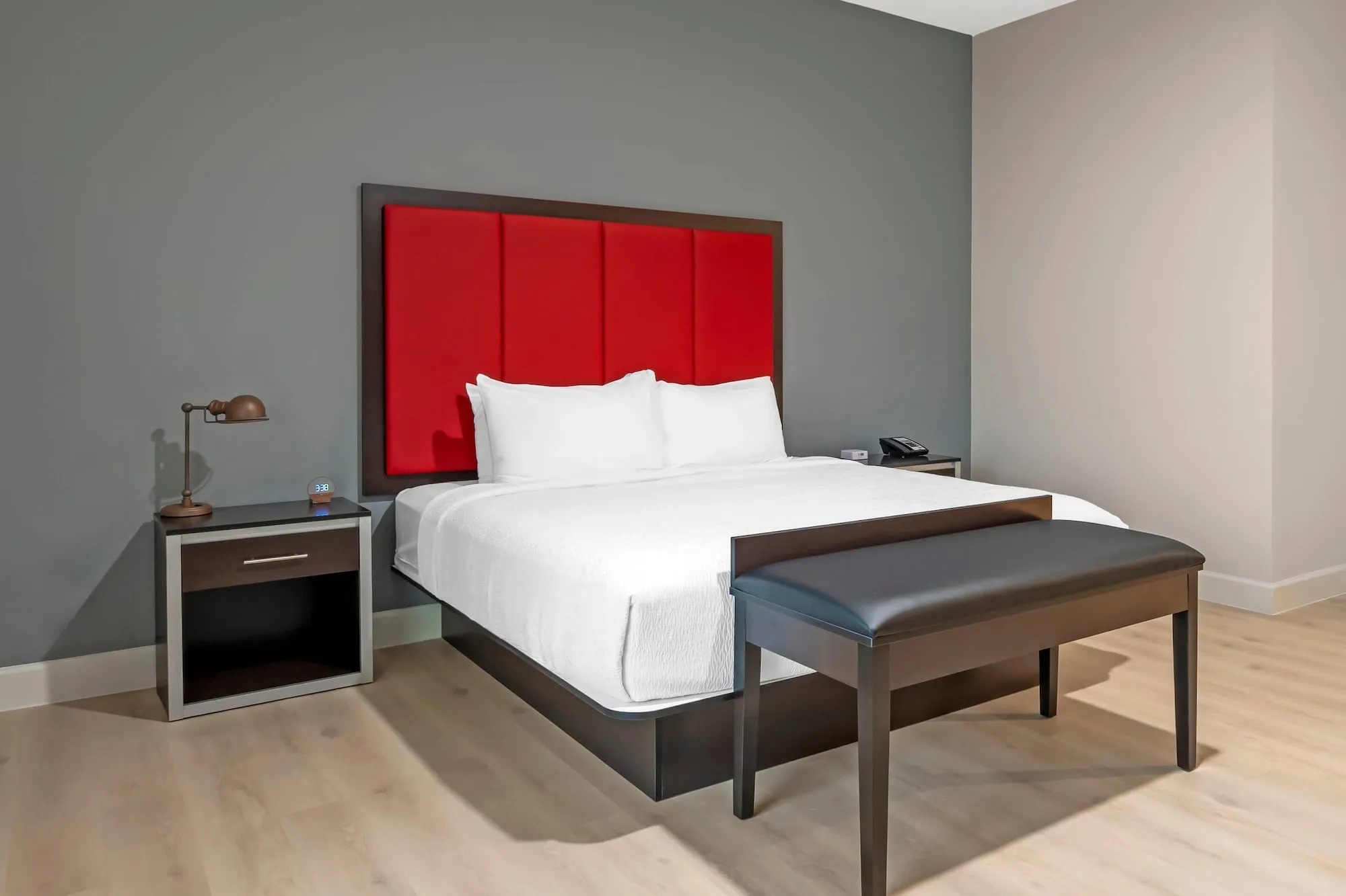 King room with red headboard