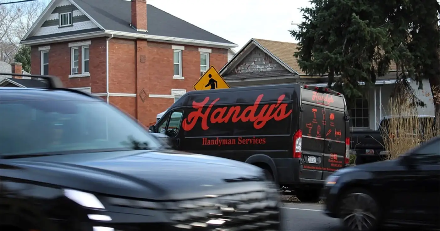 The Handy's van parked outside a brick home on a Salt Lake City street
